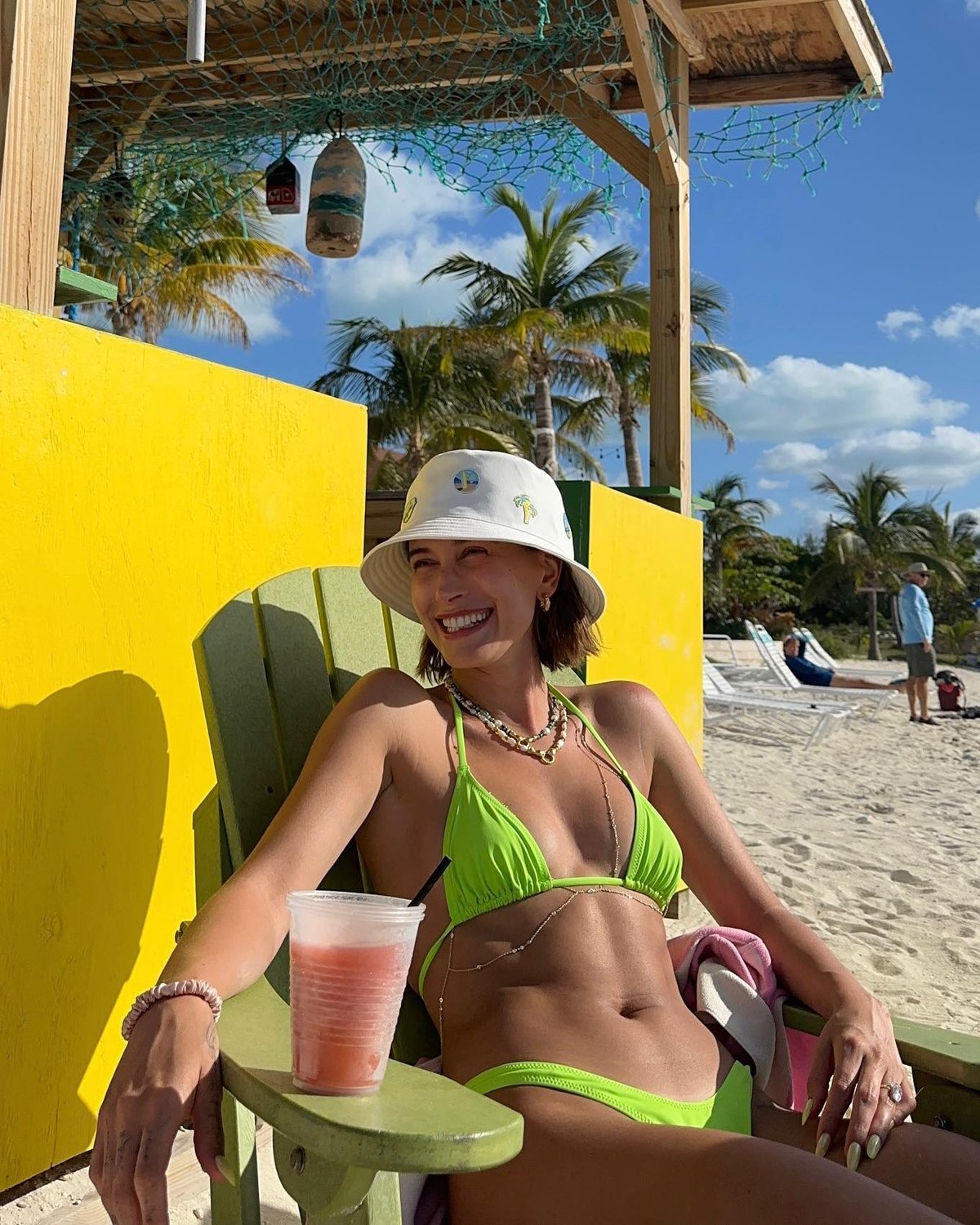 Hailey Bieber wearing a green bikini