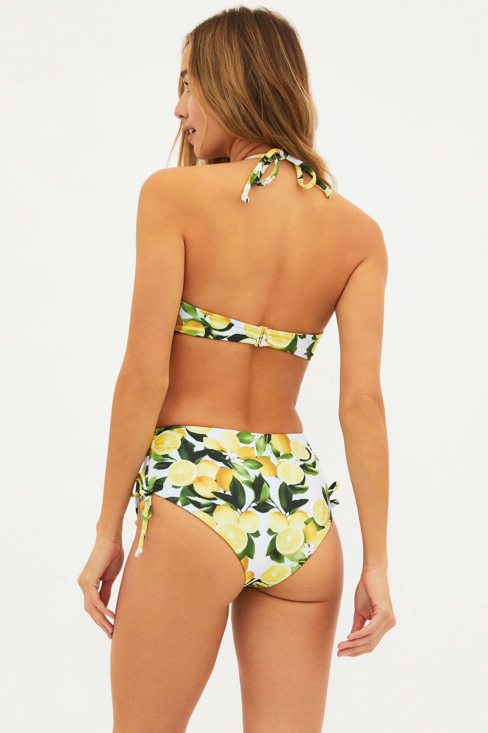 Back view of the Beach Riot x Rachel Parcell lemon-print bikini: halter-tie Abby Top and high-waisted Heather Bottom