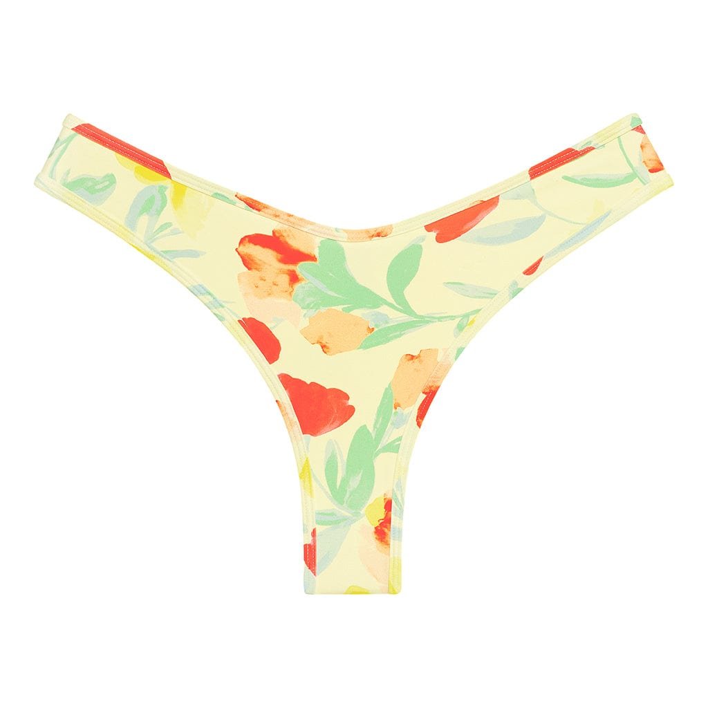 Lulu Bottom in Helena Floral, a high-cut pale yellow bikini bottom with red, orange and green flowers
