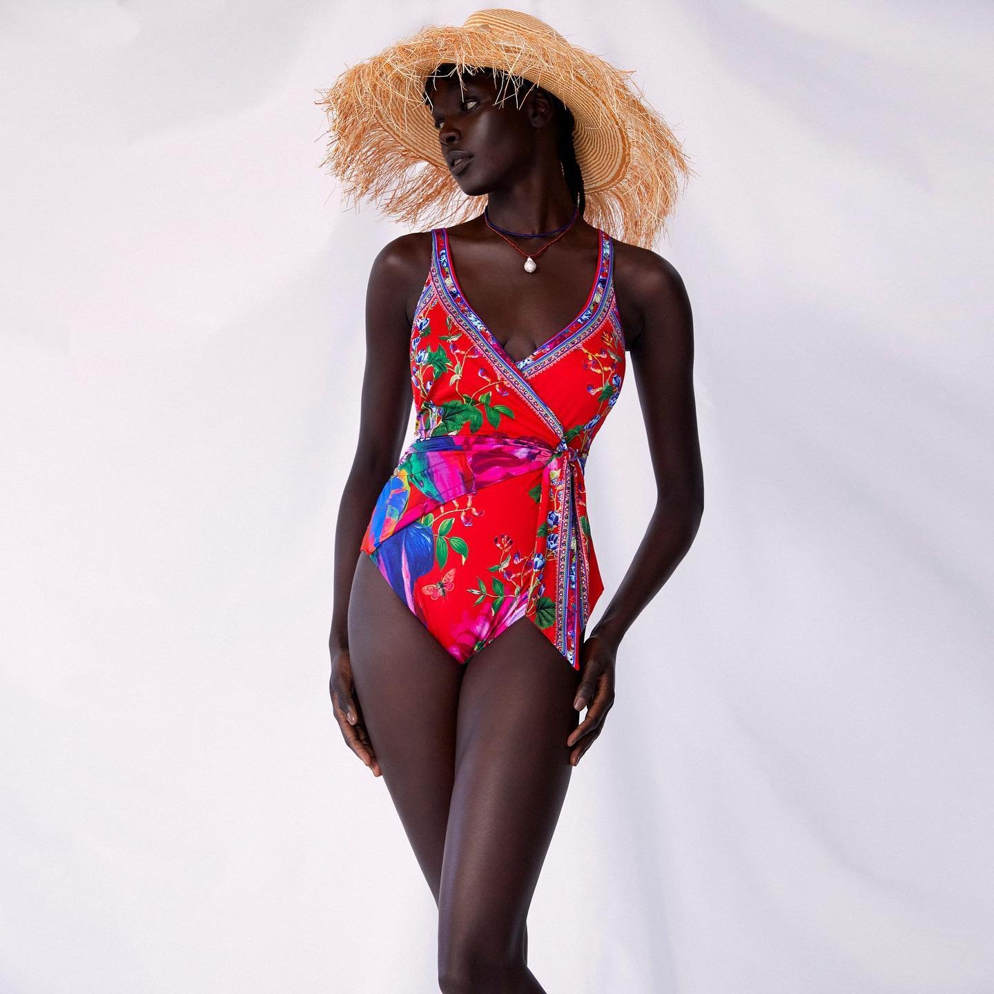 Image of woman wearing a printed swimsuit by Camilla