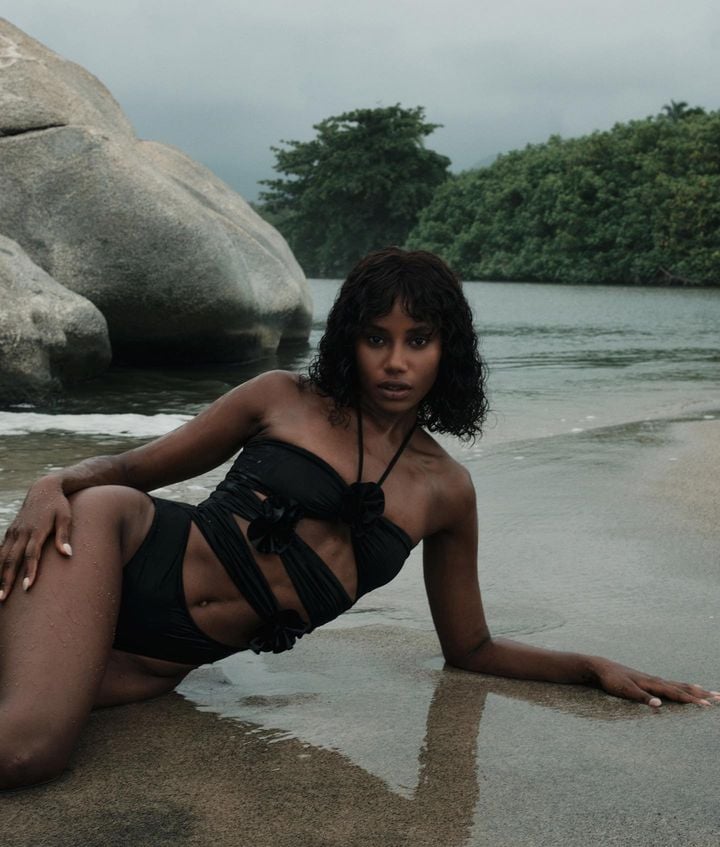 Trinitaria one-piece in black by Maygel Coronel