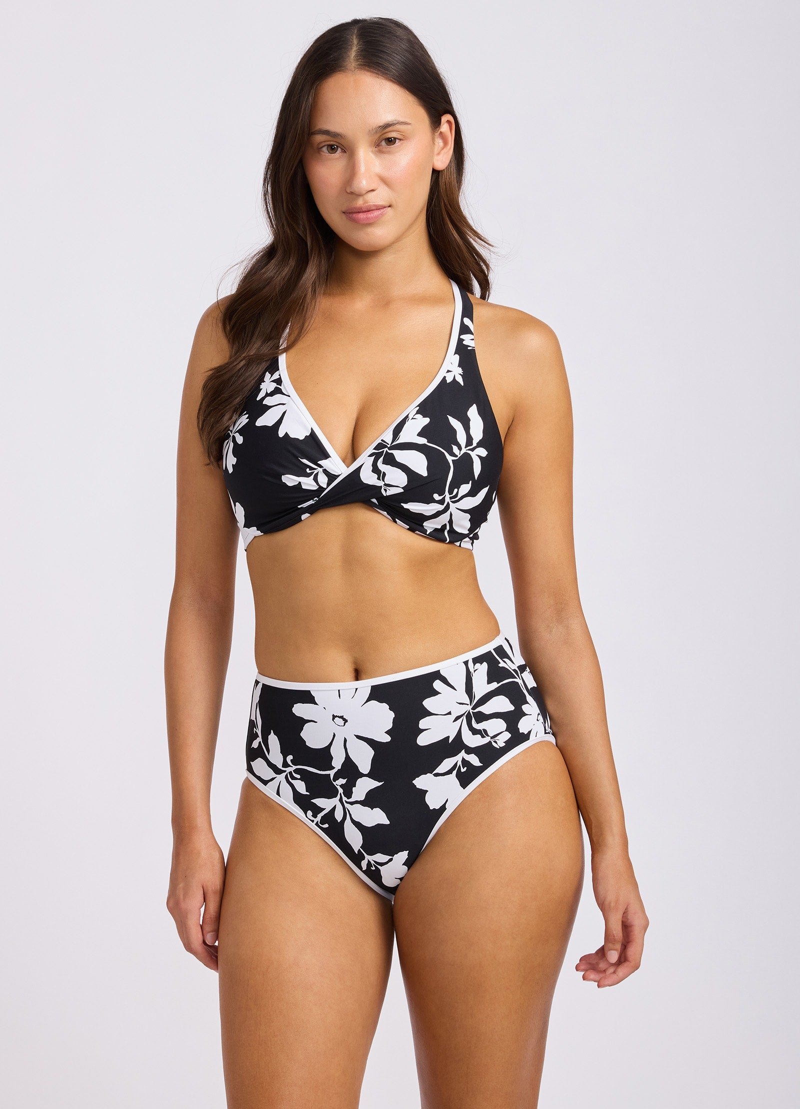Seafolly Mayflower Wrap Front F Cup Bikini Top and High Waist Bottom in Black Floral in Black and white Mayflower floral, lifestyle editorial shot