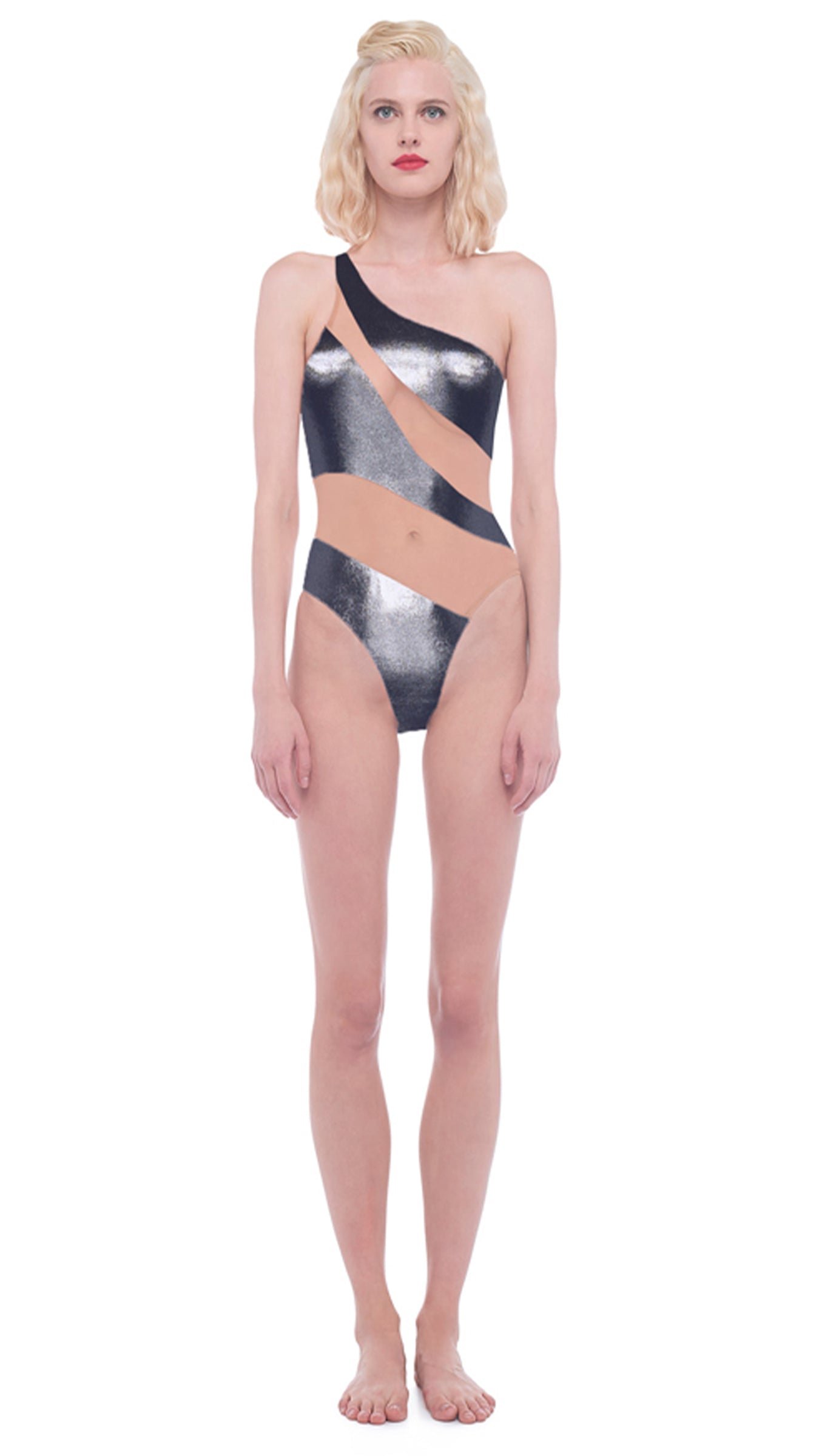 Model in Norma Kamali's Snake Mesh Mio in metallic gunmetal, a one-shoulder one-piece with sheer diagonal mesh panels