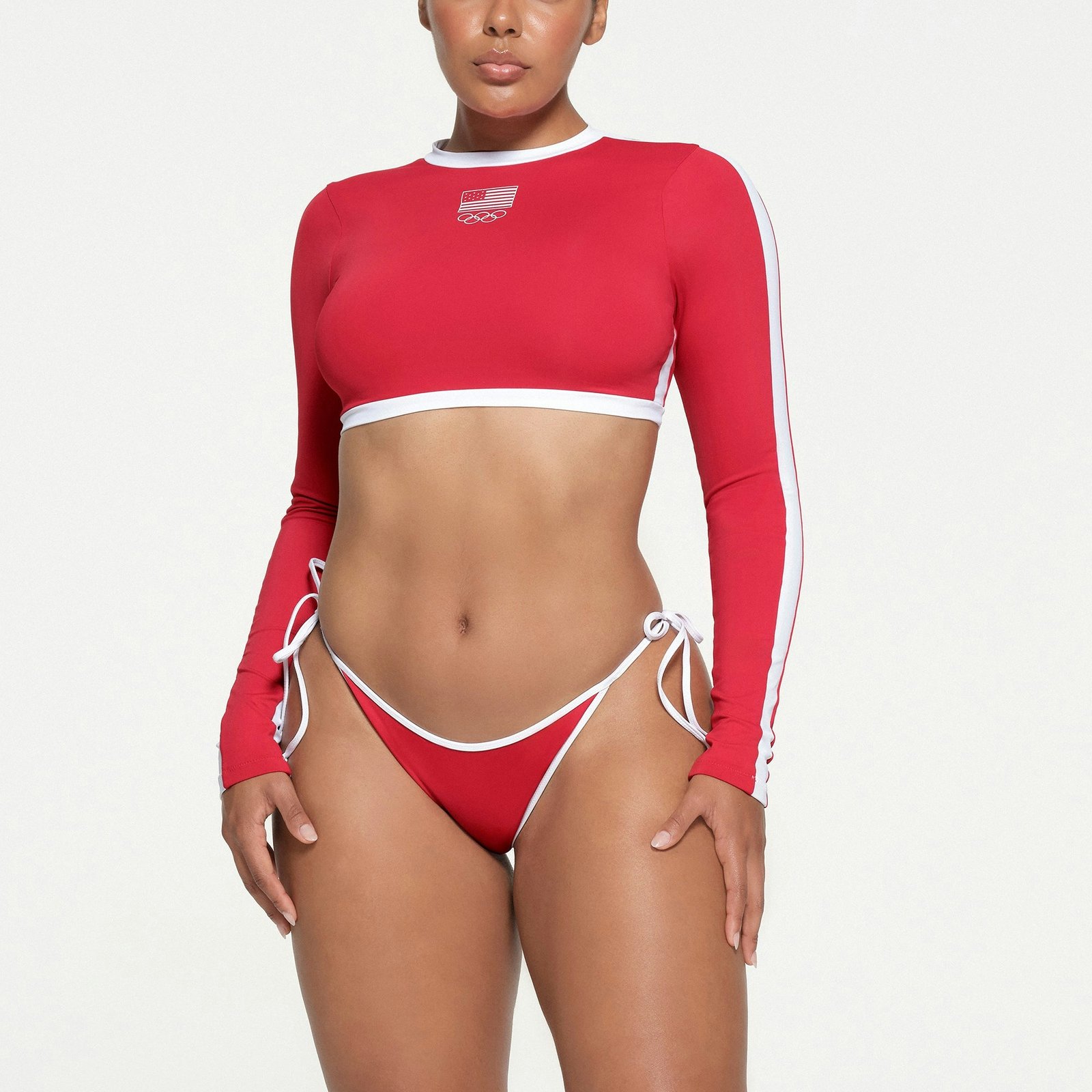 IGNATURE SWIM OLYMPIC LONG SLEEVE CROPPED T-SHIRT and SIGNATURE SWIM DIPPED TIE BOTTOM by Skims
