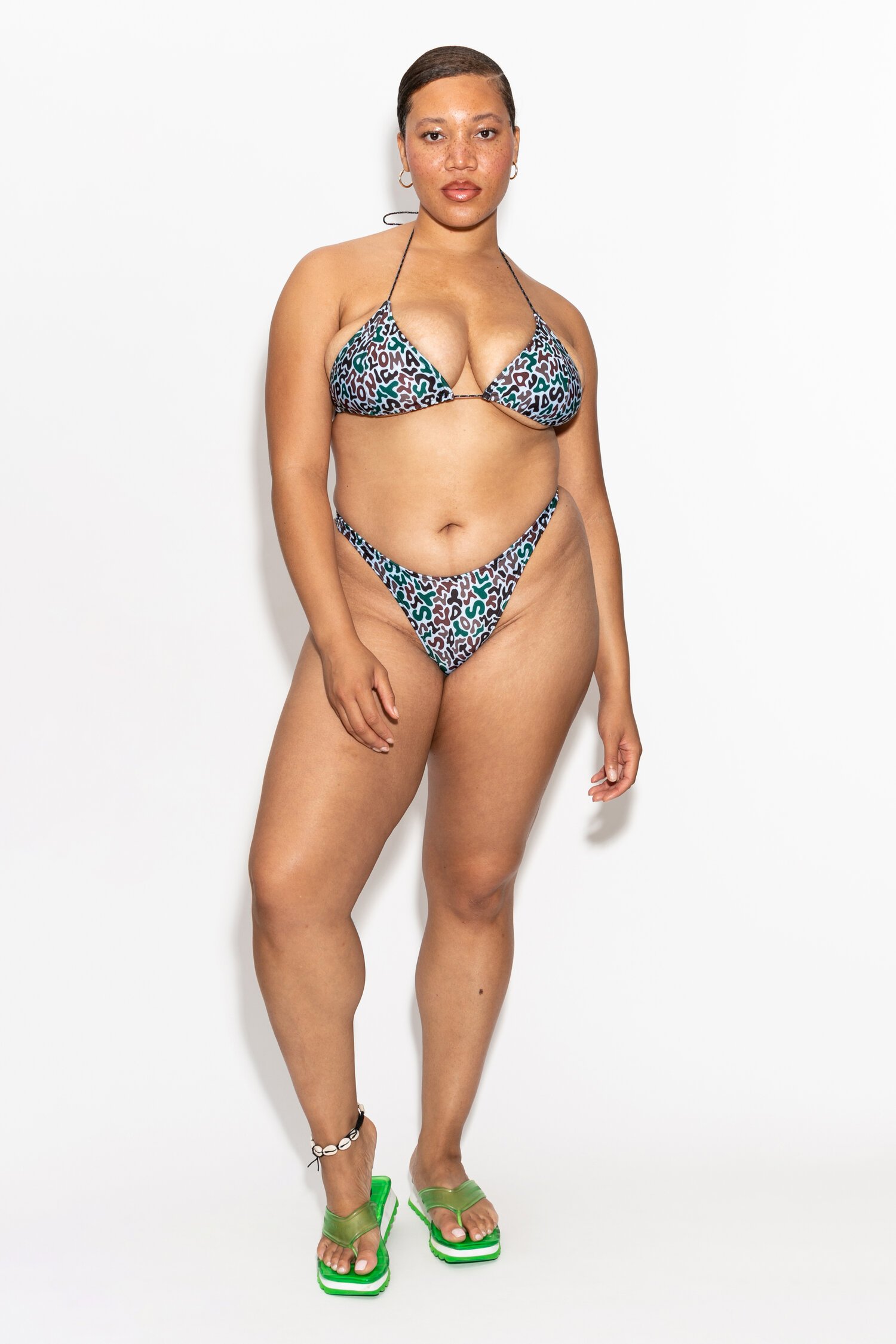 Model in the Ari triangle top and Luz bottom in the Malachite letter print by Dos Swim