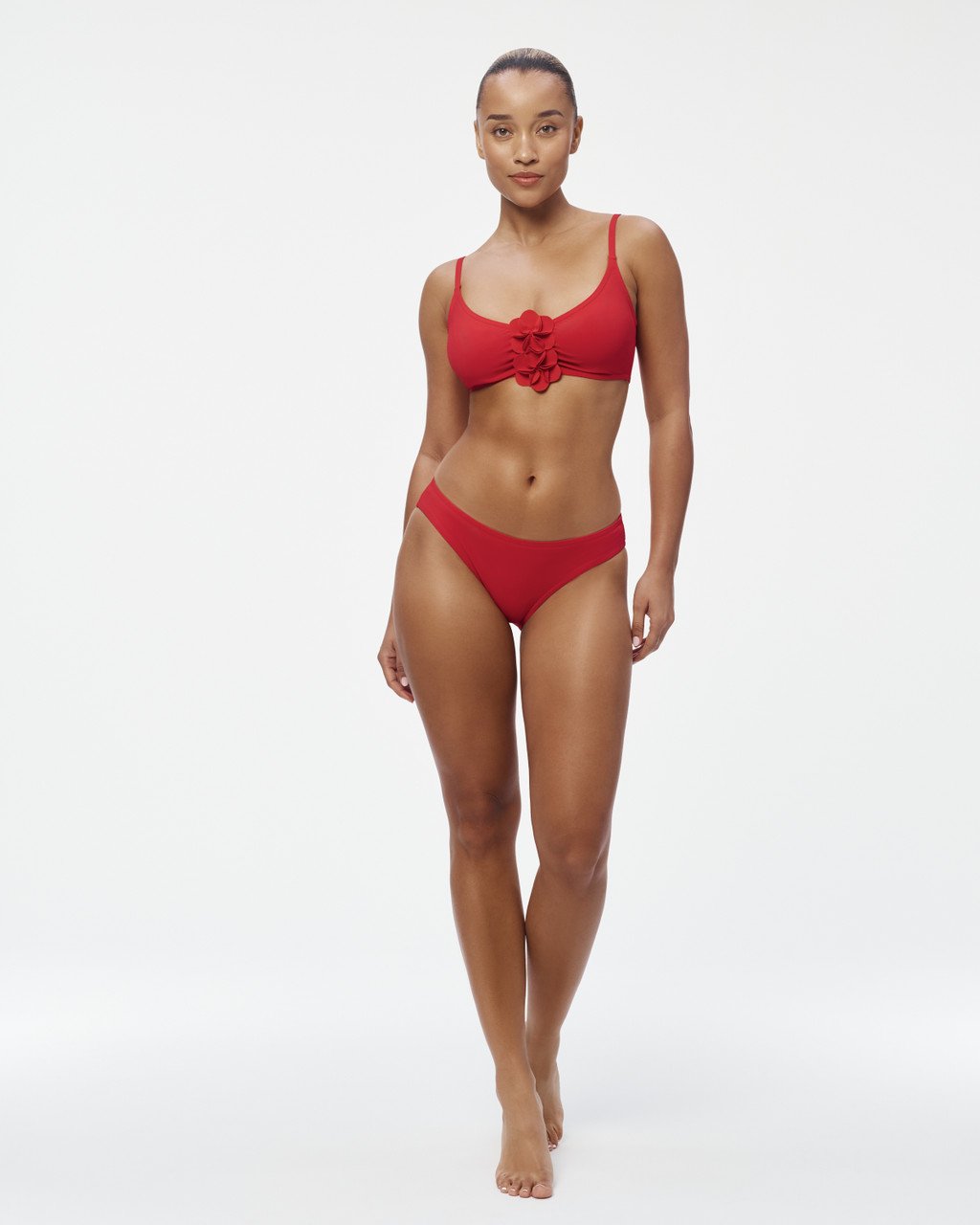 Model in the Tess Underwire Top and Basics Hip Pant in scarlet, full length on a white background