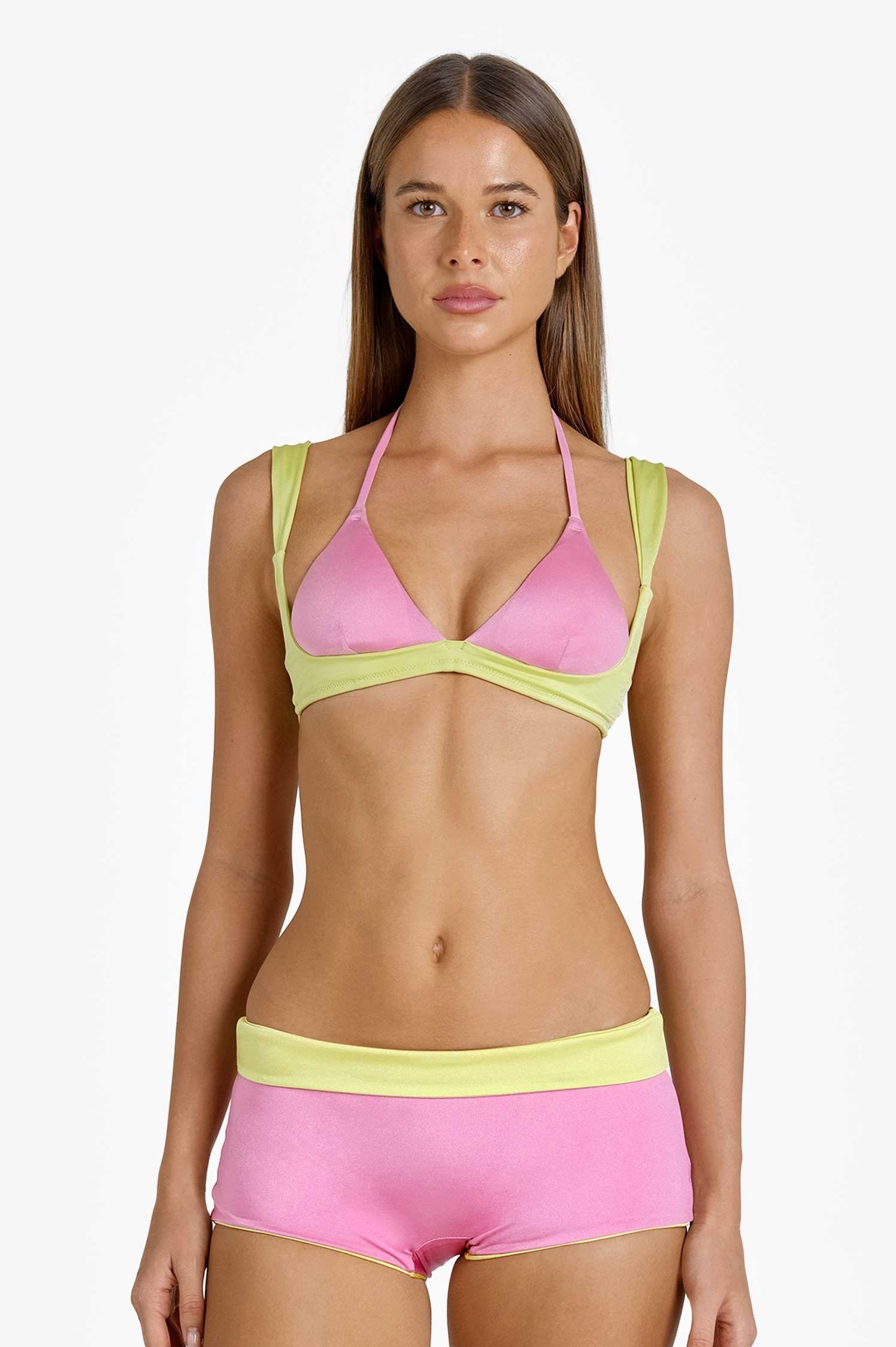 Model in the Tatum set in Guava Swirl by Blackbough Swim, pink cups bound in lime with a pink boyshort, front view